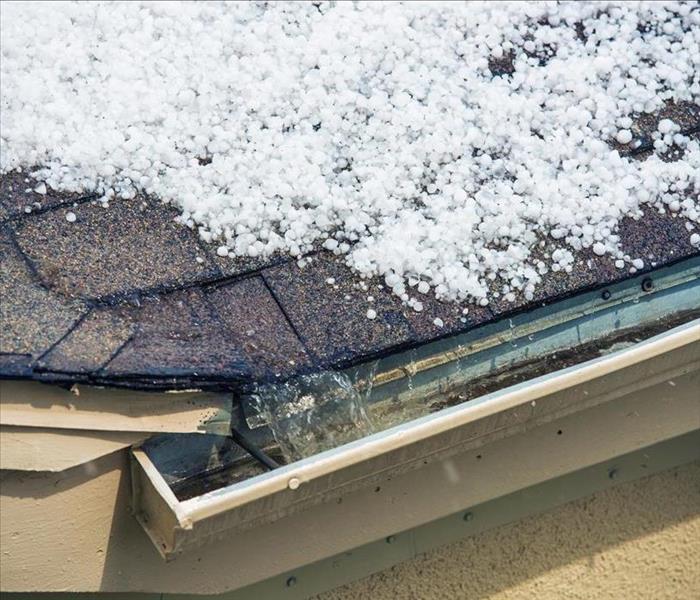 Image of hail on the roof of a home